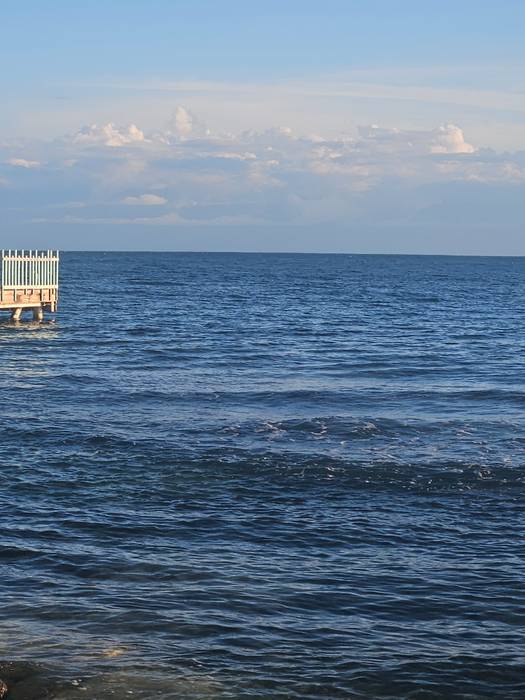 A calm, open sea horizon